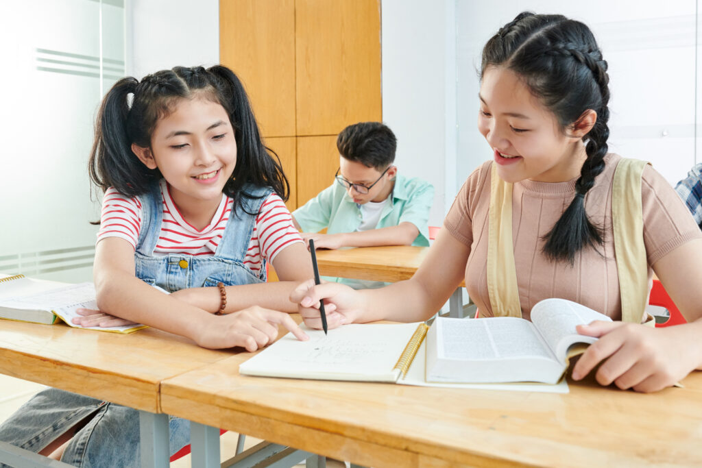 Students learning to reduce common PSLE math mistakes through guided problem-solving discussions, structured reasoning, and collaborative Mathematics practice.