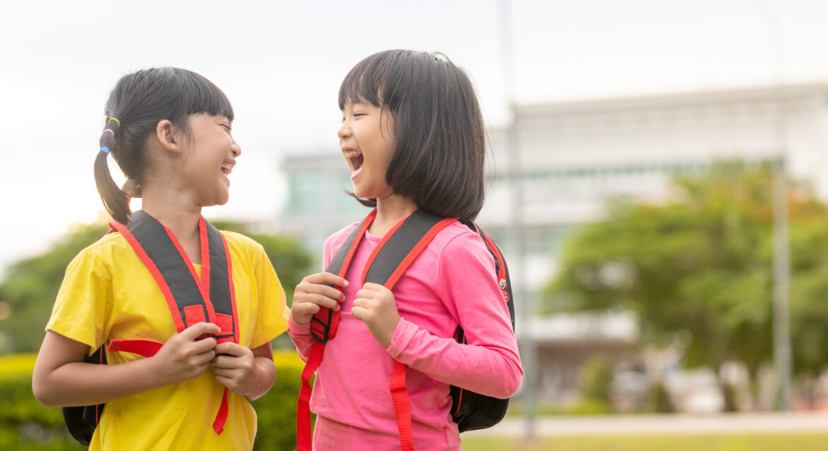 Two-primary-school-kids-smiling-at-each-other-for-finding-the-best-primary-math-tuition-singapore