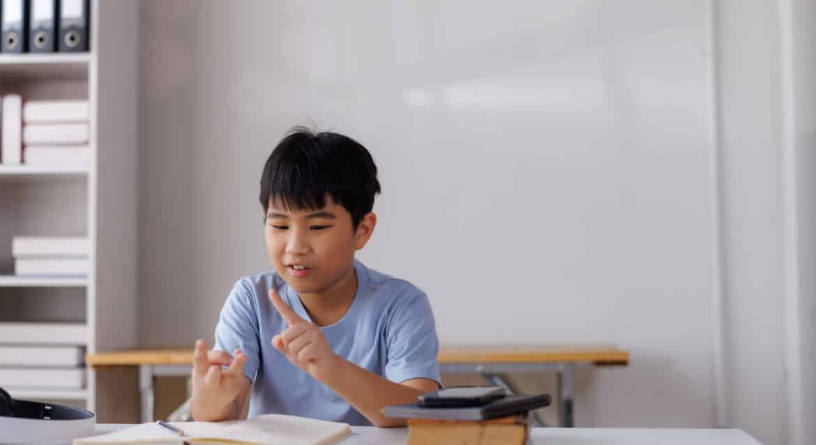 Primary school student reading a PSLE problem sum before deciding which method to use